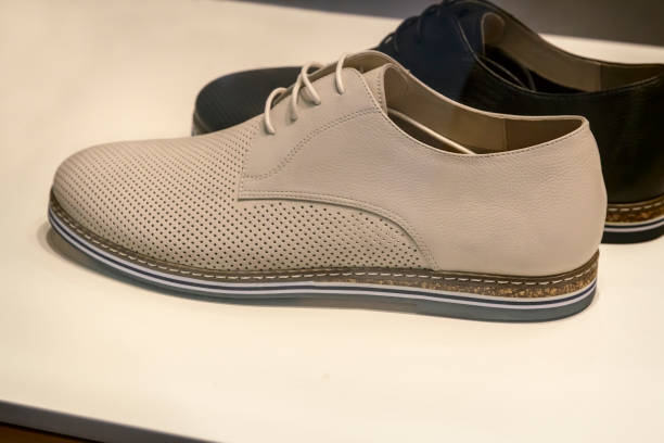 istock Mens shoes in a shop window. 1300005100
