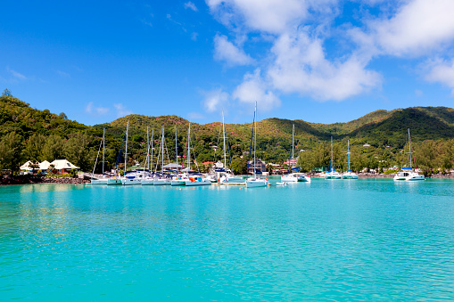 turquoise water at yachting harbor in praslin island, seychelles islands, indian ocean, africa.