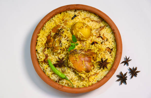 istock Chicken biryani on black background, Spicy indian handi biryani. 1300007594