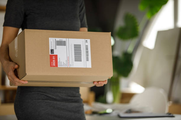 istock Carrying a package to be shipped out 1300008868