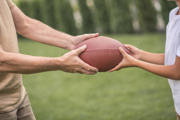 istock Close up of hands with a ball 1300008947