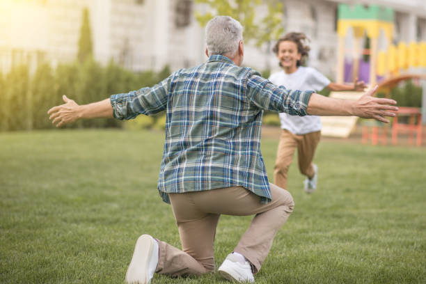 istock Boy running to his dad and looking happy 1300009013