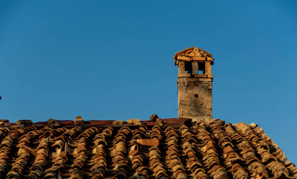 istock Brick chimney and earthen tile roof in old Anatolia 1300009062