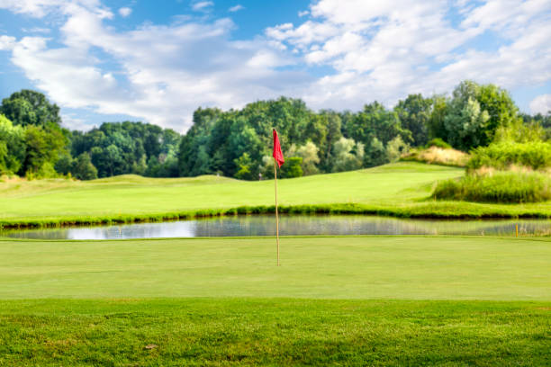 istock Putting green with a flag at a golf course on a summer day 1300009221