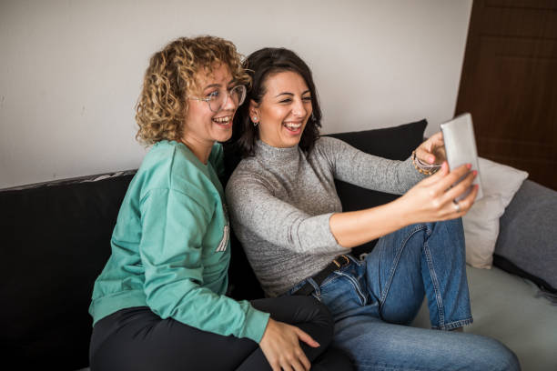 istock Lesbian couple taking selfie at home 1300010205