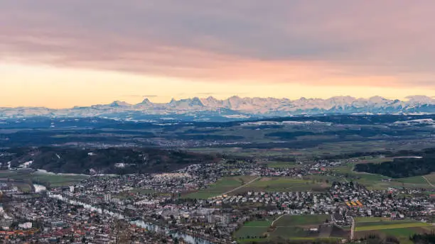 View from the municipality of Magglingen above the city of Biel Bienne over the urban area, the flatlands of the canton of Bern to the swiss alps