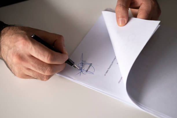 istock Business man signing contract, making a deal 1300011917