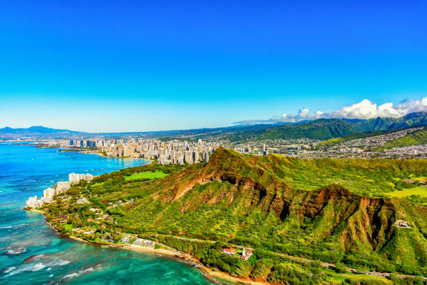 Diamond Head State Park, Hawaii Aerial view of the majestic Diamond Head volcanic crater towering over the suburbs of Honolulu, Hawaii. honolulu stock pictures, royalty-free photos & images