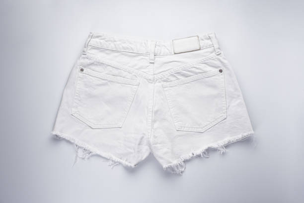 istock White denim shorts, back pockets, top view. 1300012888