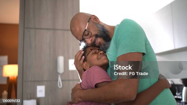 Father Embracing Son At Home Stock Photo - Download Image Now - Father, Child, Embracing
