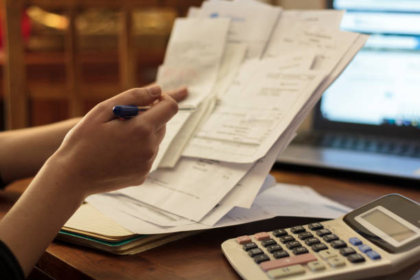 istock Woman doing financial accounting 1300014137