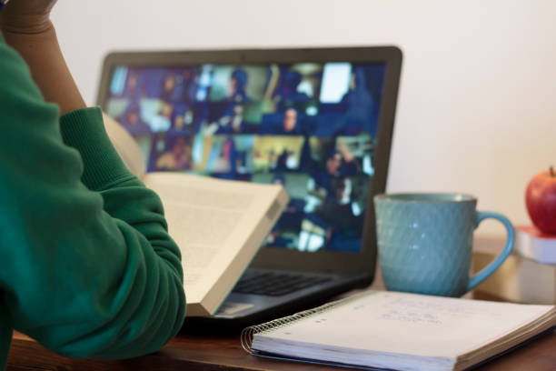 istock Young woman taking an online class at home 1300014139