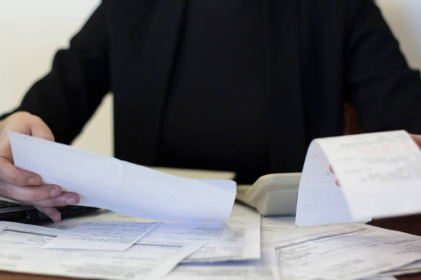 istock Woman doing financial accounting 1300014143