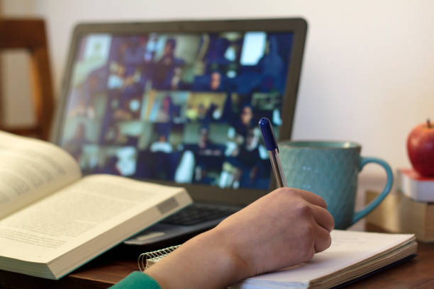 istock Young woman taking an online class at home 1300014148