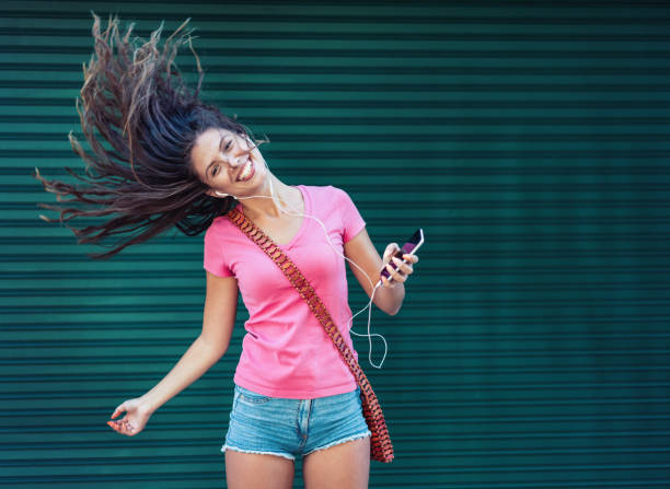 istock Woman dancing to the music 1300015145