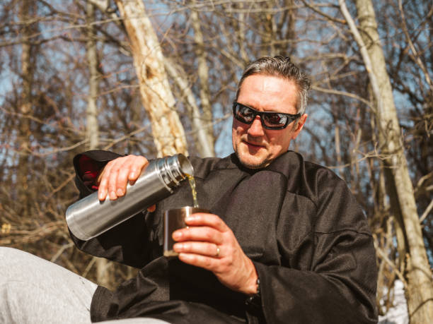 istock Mature man drinking tea outdoors 1300015804