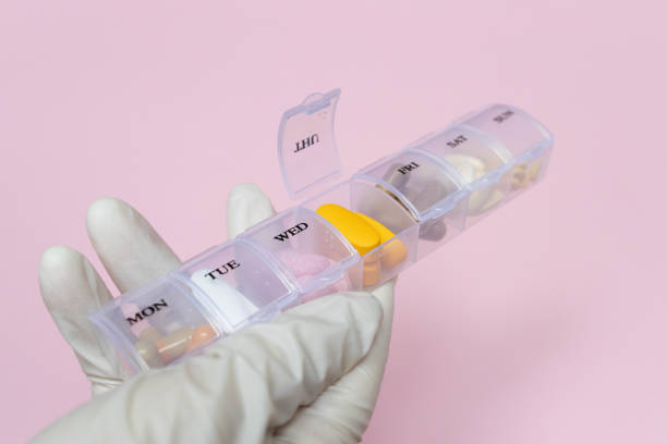 istock Daily Meds on pink background 1300019414