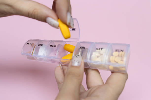 istock Daily Meds on pink background 1300019656