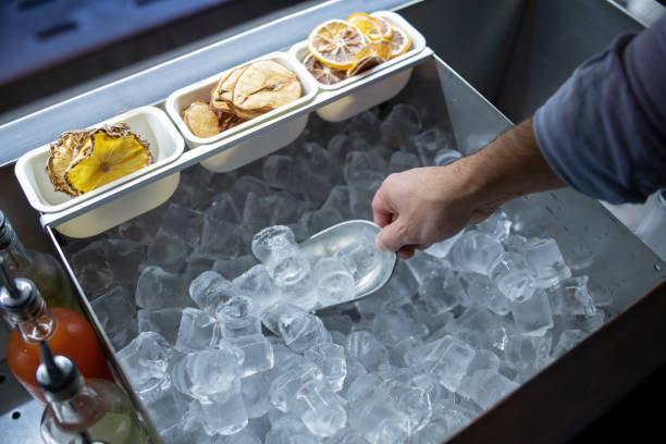 Shot of a hand scooping ice cubes.