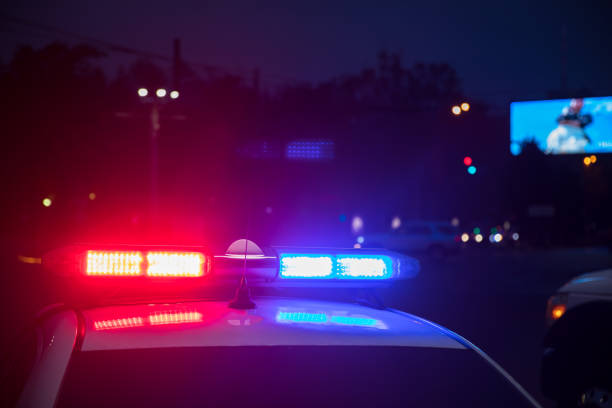 istock Police car at night 1300021136