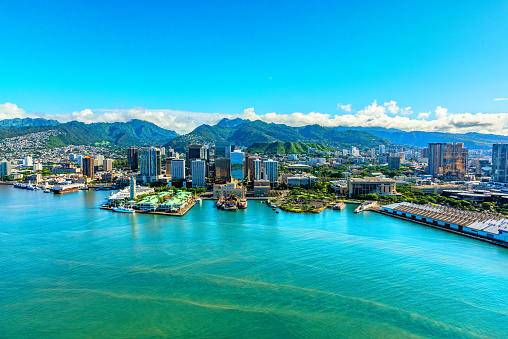 Aerial view of the beautiful downtown area of the city of Honolulu along the Pacific Ocean in Hawaii, USA.