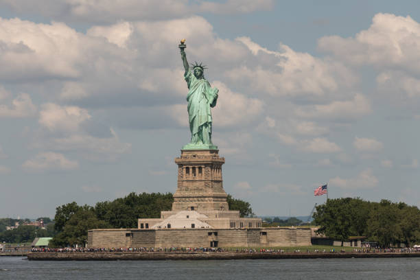 New York, USA - Jul 24, 2019: The iconic Statue of Liberty from the free Staten Island Ferry late in the day.