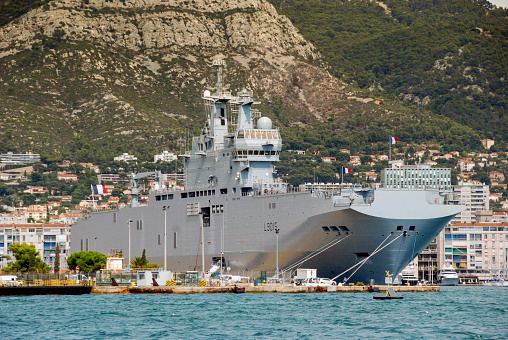 Toulon, France - September 2011: Landscape view of a French Navy aircraft carrier in the port of Toulon. The town has a naval base in the harbour
