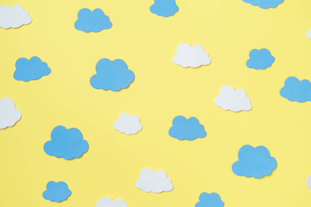 istock Creative composition of orange background surrounded by clouds mockup, copy space 1300025246