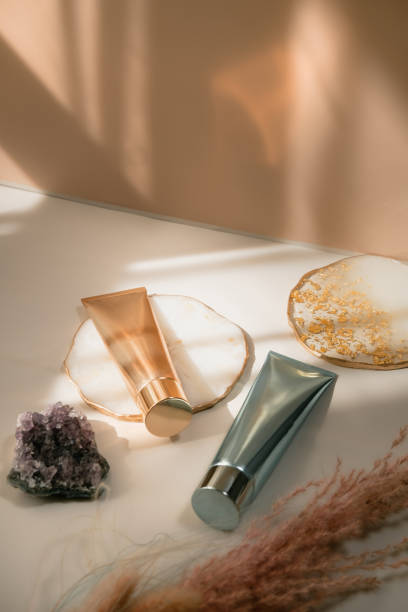 istock Beauty product still life light and shadow pastel gold 1300026542