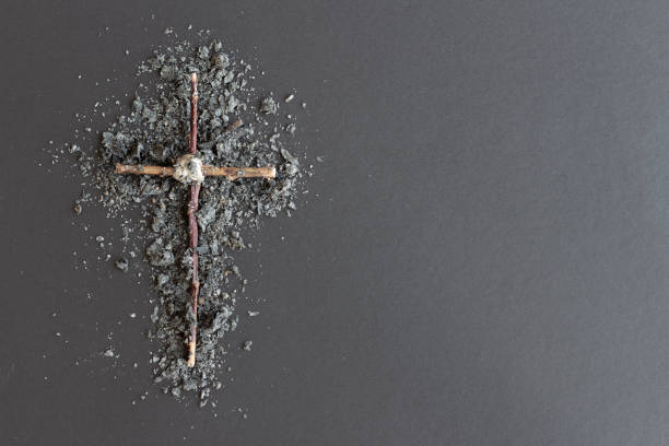istock Wood and ash cross on dark background 1300027179