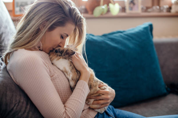istock Beautiful young woman and her bunny pet 1300028331