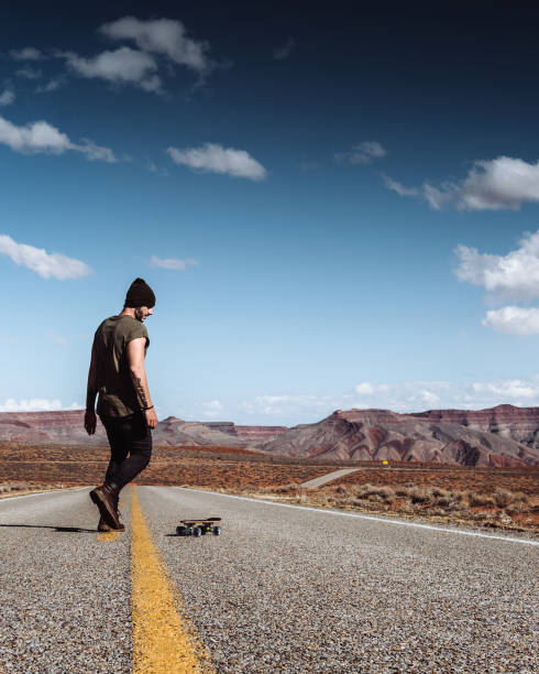 istock man skating in the monument valley 1300028485