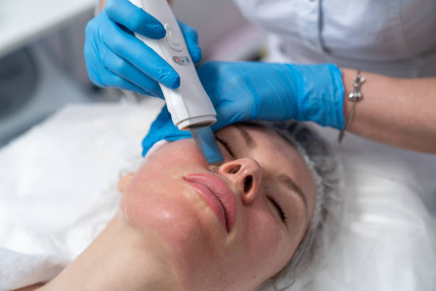 istock cosmetologist performs facial skin cleansing procedure 1300033634