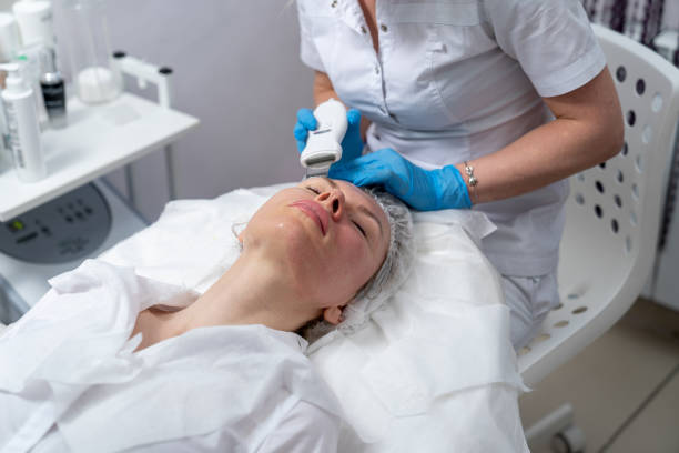 istock cosmetologist performs facial skin cleansing procedure 1300033875