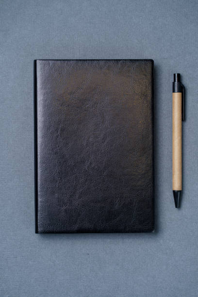 istock Leather notebook cover on a gray background 1300035727