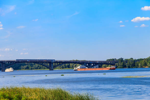 istock Heavy long barge sailing on the Dnieper river in Kiev, Ukraine 1300037773