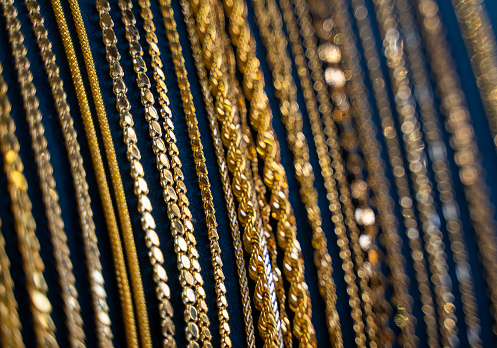 Close up of shiny gold chains and necklace jewelry