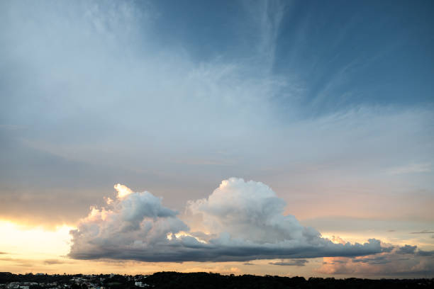 Photograph of a sunset sky with a large cloud
