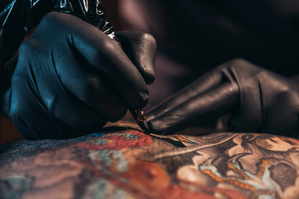 Tattoo Artist Stock Photos, Pictures & Royalty-Free Images - iStock