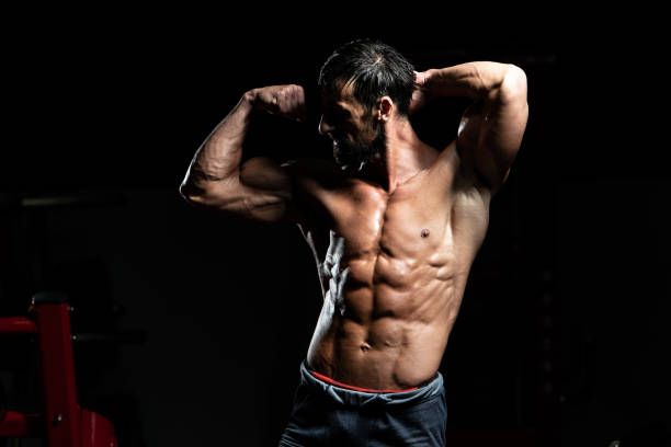 istock Serious Bodybuilder Standing In The Gym 1300047767
