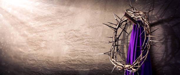 Crown Of Thorns And Purple Robe Hanging On Nail Crown Of Thorns And Purple Robe Hanging On Nail In Stone Wall With Light Rays
 - Crucifixion Of Jesus Christ the crucifixion photos stock pictures, royalty-free photos & images