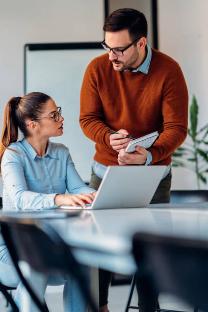 istock Colleagues working together in the office 1300055610