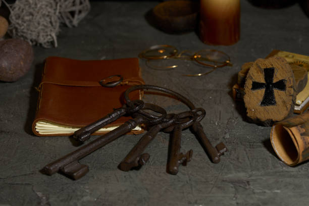 istock old keys on wooden table and rustic stone 1300057250