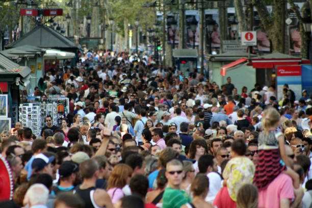 La Rambla in Barcelona Famous street La Rambla in Barcelona, Spain. Thousands of people walk daily by this popular pedestrian area 1.2 kilometer long. la rambla stock pictures, royalty-free photos & images