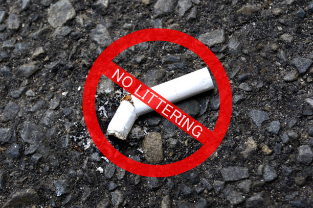 Attention for no littering cigarette on street image