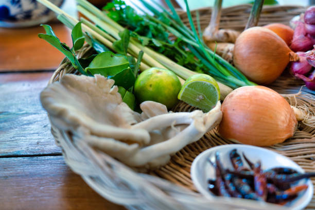 Ingredients for a Thai coconut milk soup recipe known as 'Tom Kha.’   Thailand's popular signature soup contains fresh coconut milk, straw mushroom, galangal, shallots, lemon grass, kaffir lime leaves and spicy fresh red chili.