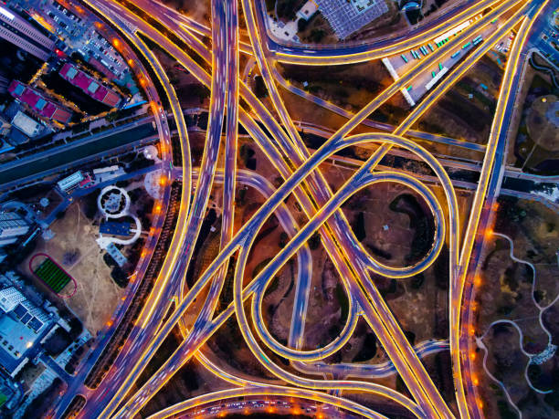 istock Aerial view of highway overpass at night 1300073251