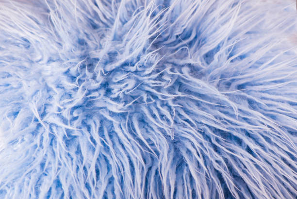 istock soft blue color faux fur fabric fluffy background 1300073269