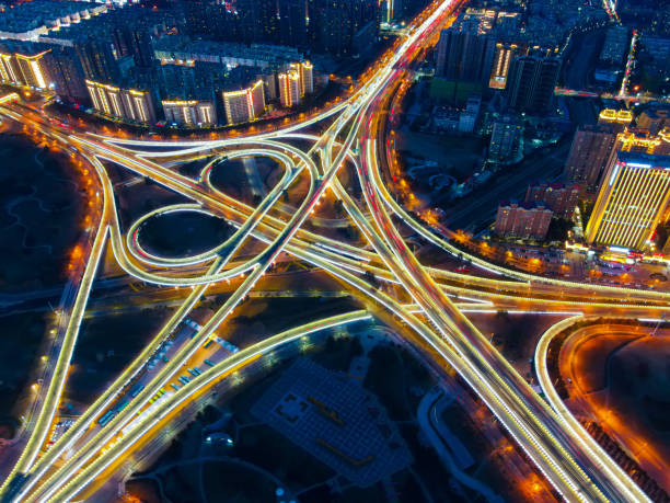 istock Aerial view of highway overpass at night 1300073331
