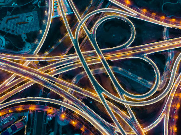 istock Aerial view of highway overpass at night 1300073341